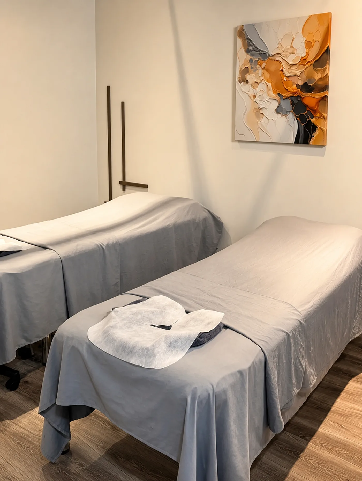 A private treatment room at Radiant Sun Wellness with two massage beds.